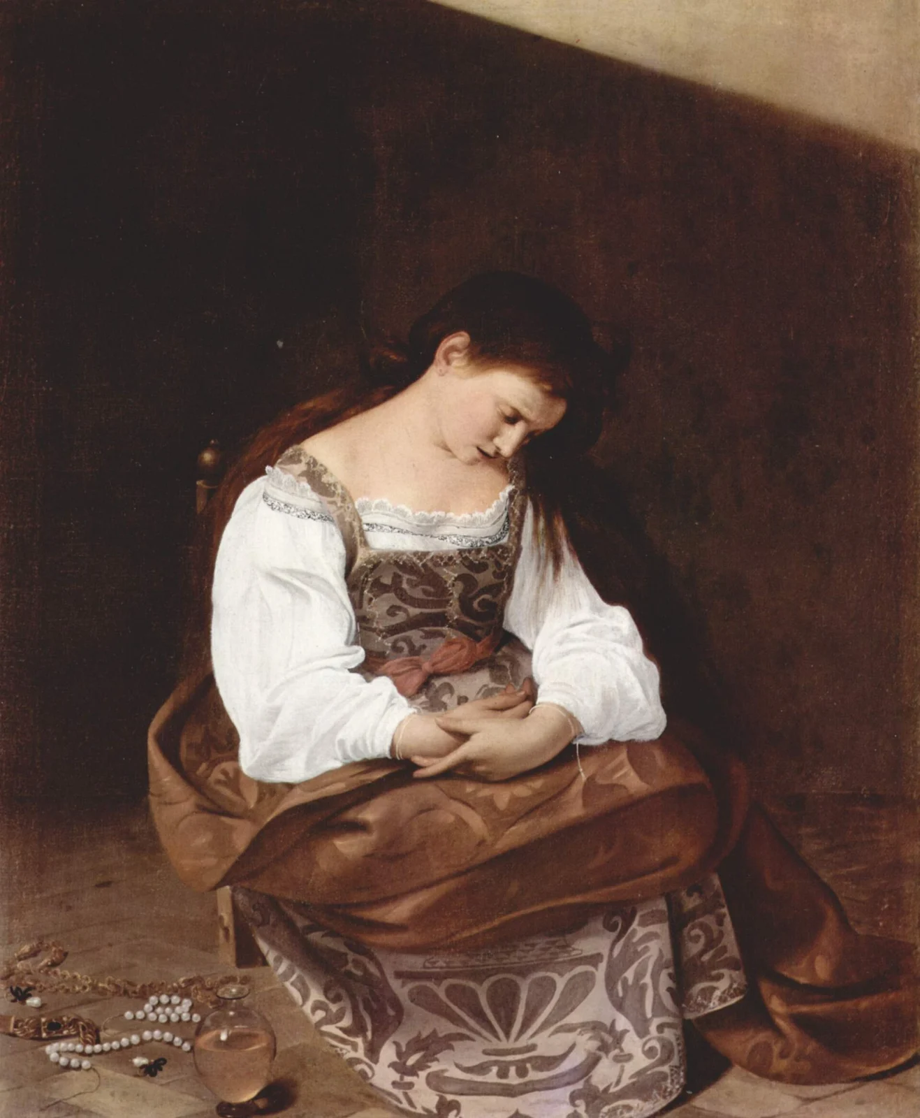 Young woman on a low chair, head bowed and hands in her lap; at her feet lie pearls, jewelry and a glass flask