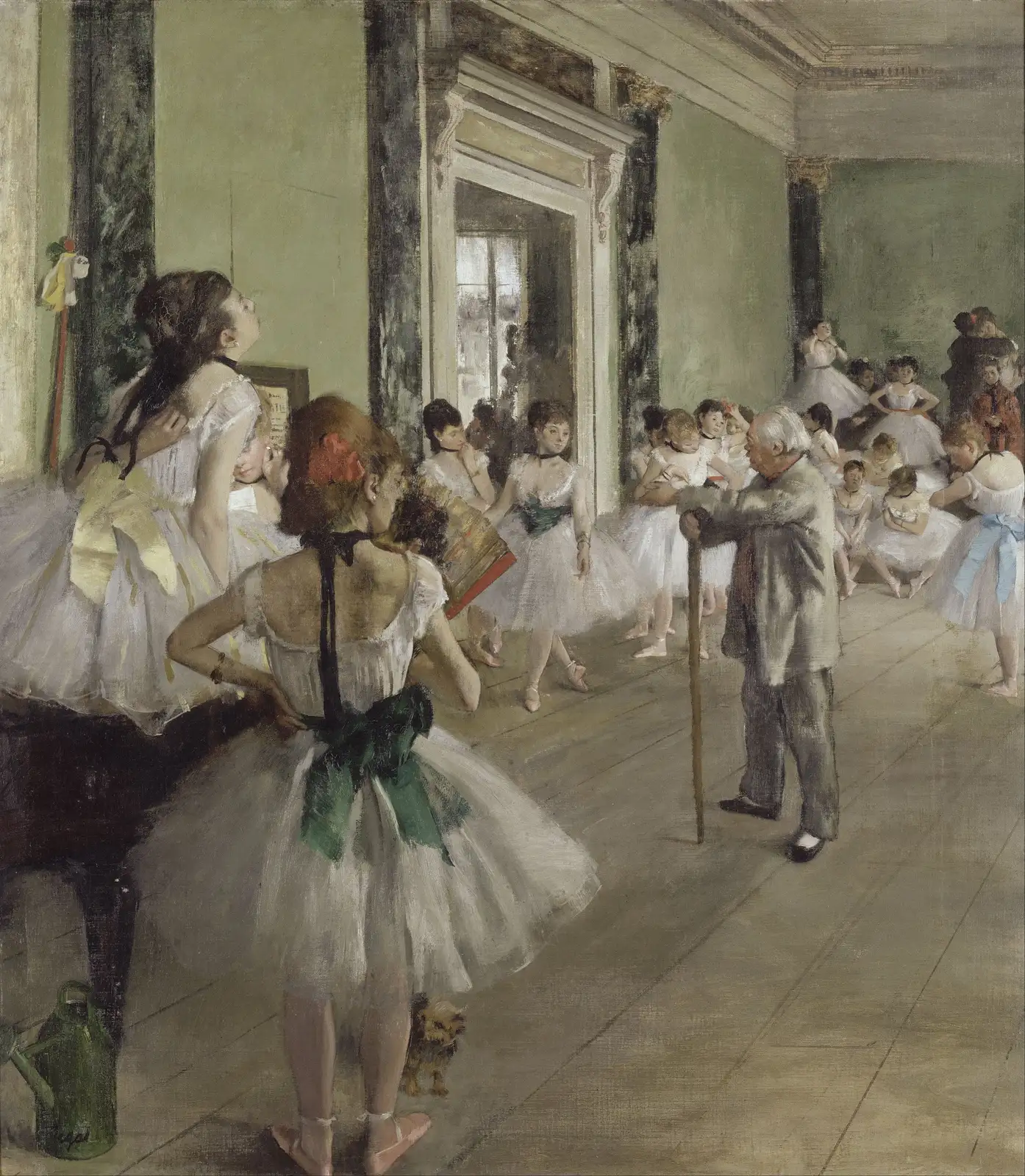 Green-walled hall full of dancers in white tutus gathered around an elderly ballet master leaning on a cane
