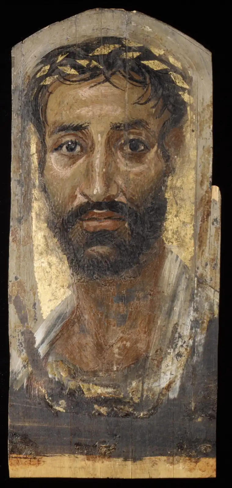 Thin, dark-bearded man with a wreath of gold leaves, large eyes and a white tunic against a worn gold ground