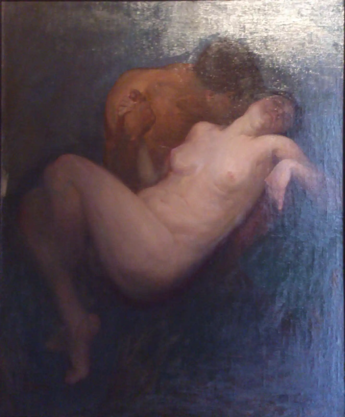 Against a dark blue ground, a man bends forward, holding the pale, reclining body of a woman in his arms