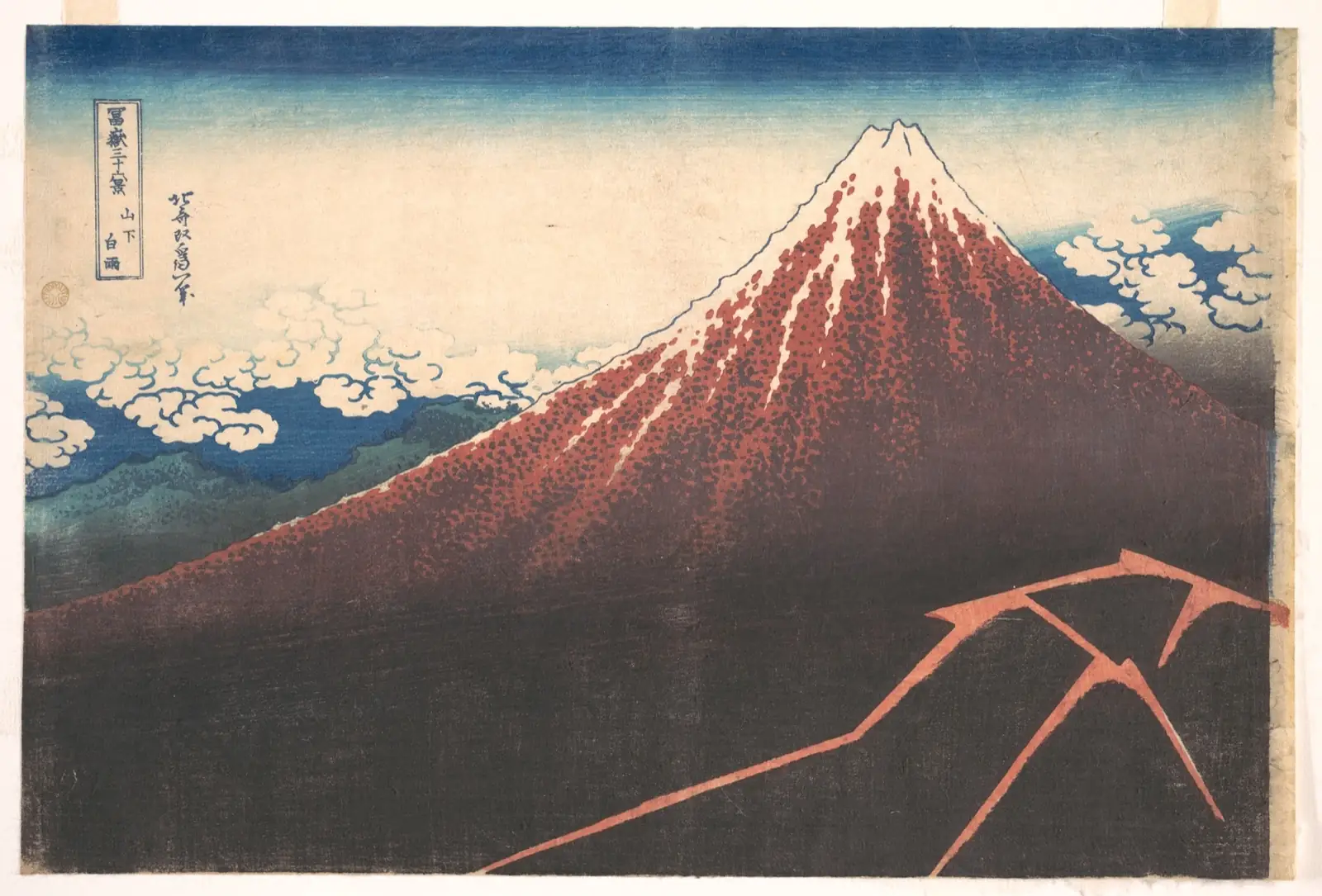 Mount Fuji with reddish slopes above an almost black base, a zigzag of lightning at lower right and white clouds