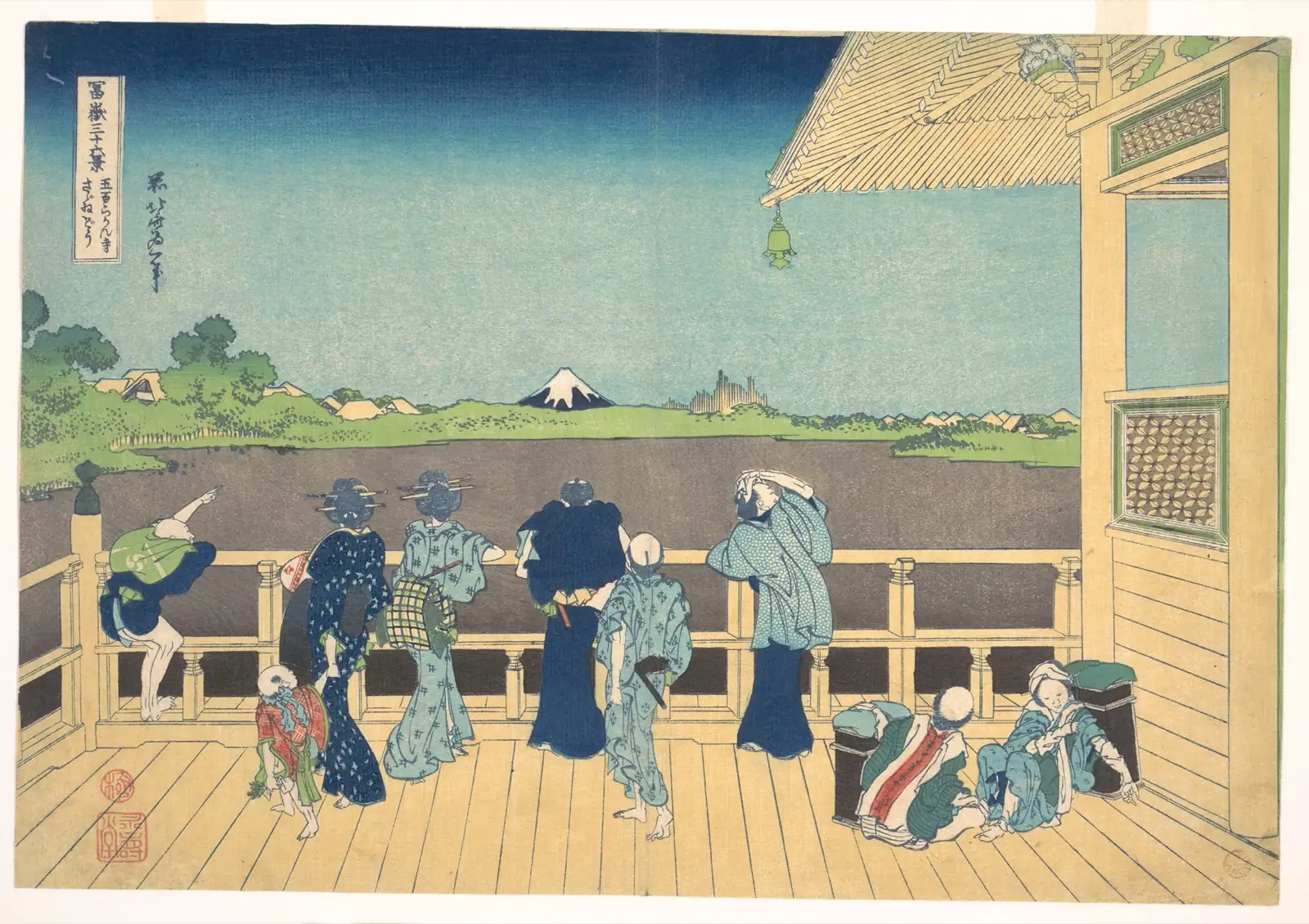 Visitors on a wooden balcony gaze toward distant, snowcapped Mount Fuji across a wide plain