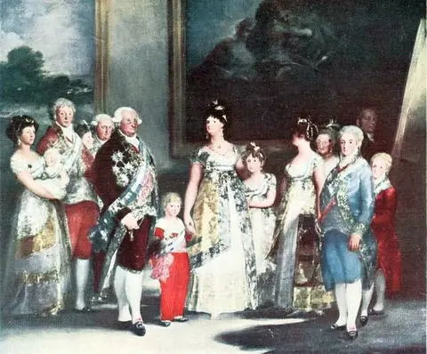 Royal family standing almost in a row in a palace room, in gowns, sashes and jewels; at center, a lady with two children