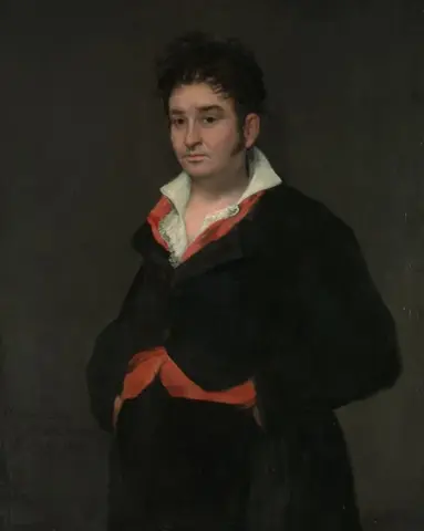Half-length man in a black coat, open white shirt, red waistcoat and red sash against a dark background