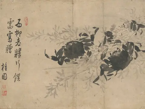 Two black crabs among pale grey reeds, with four columns of calligraphy and red seals on the left