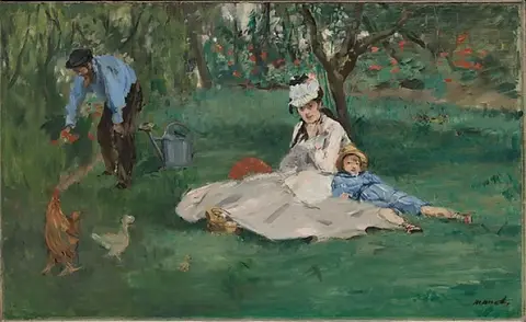 Woman in a white dress and a boy in a blue suit sitting on a garden lawn, a man tending flowers on the left