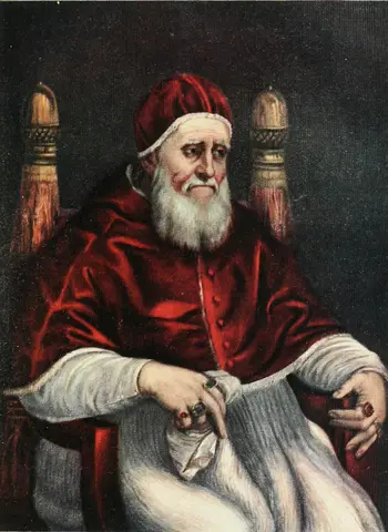 White-bearded old man in a red velvet cap and cape, seated in a chair with gilded finials, looking down
