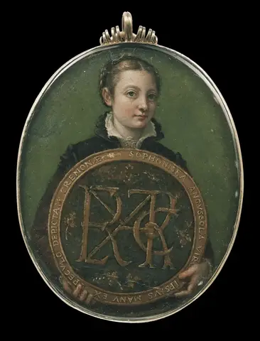 Young woman in a dark dress holds a large medallion with interlaced letters, set inside an oval metal frame