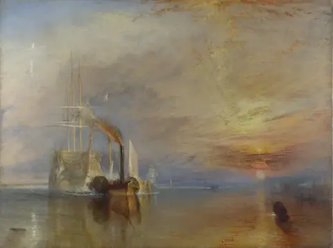 Pale three-masted warship towed by a small dark steam tug on a calm river, the sun setting in a blaze on the right
