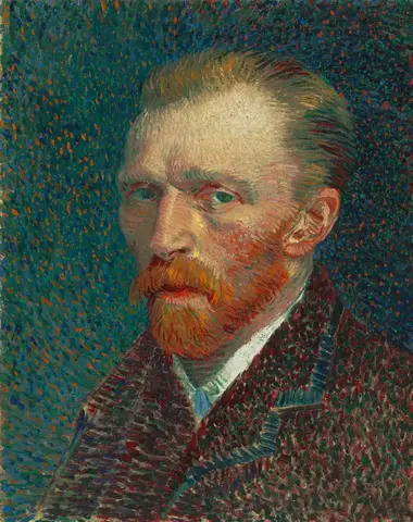 Hombre de barba pelirroja y ojos verdes, de tres cuartos, con saco oscuro sobre un fondo azul verdoso de puntos