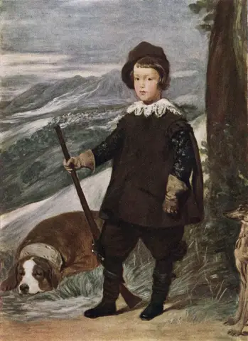 Young boy in a hat, lace collar and brown hunting clothes holds a gun upright beside a large dog lying on the grass
