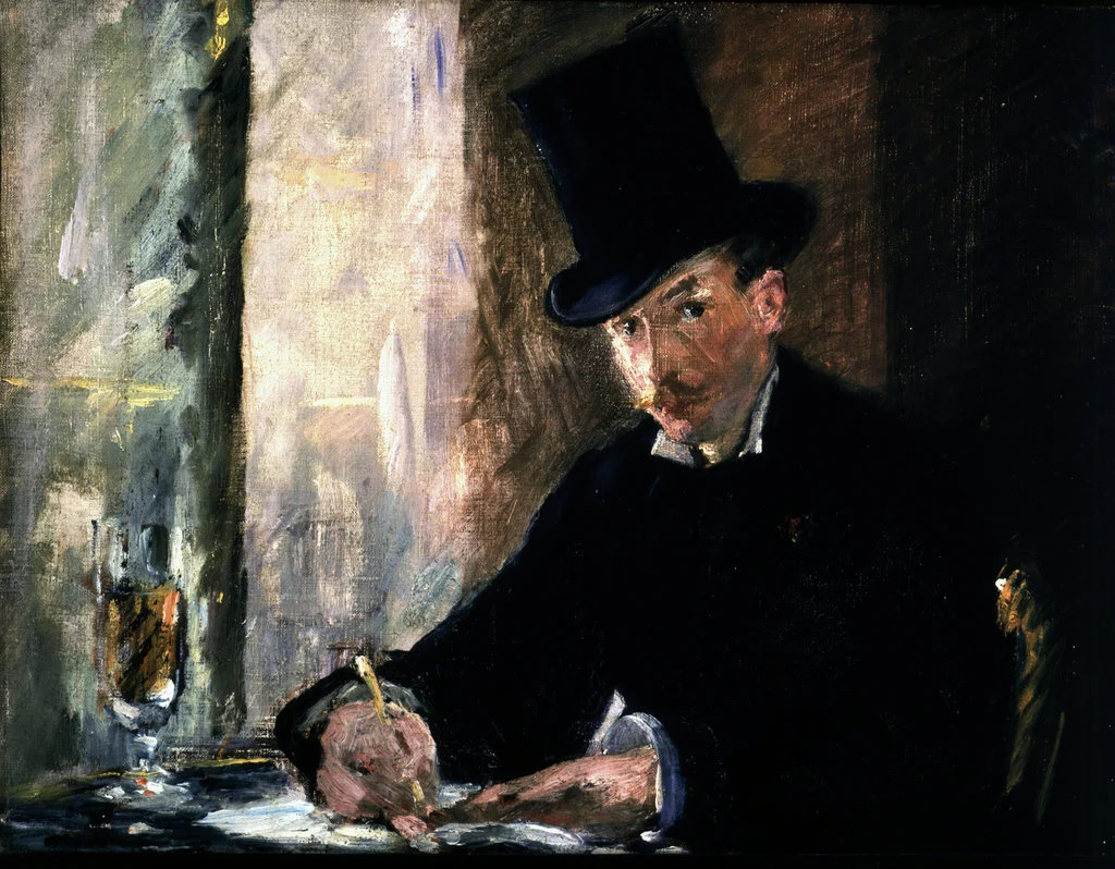 Man in a top hat and black coat writing at a café table, beside a bright window and a glass