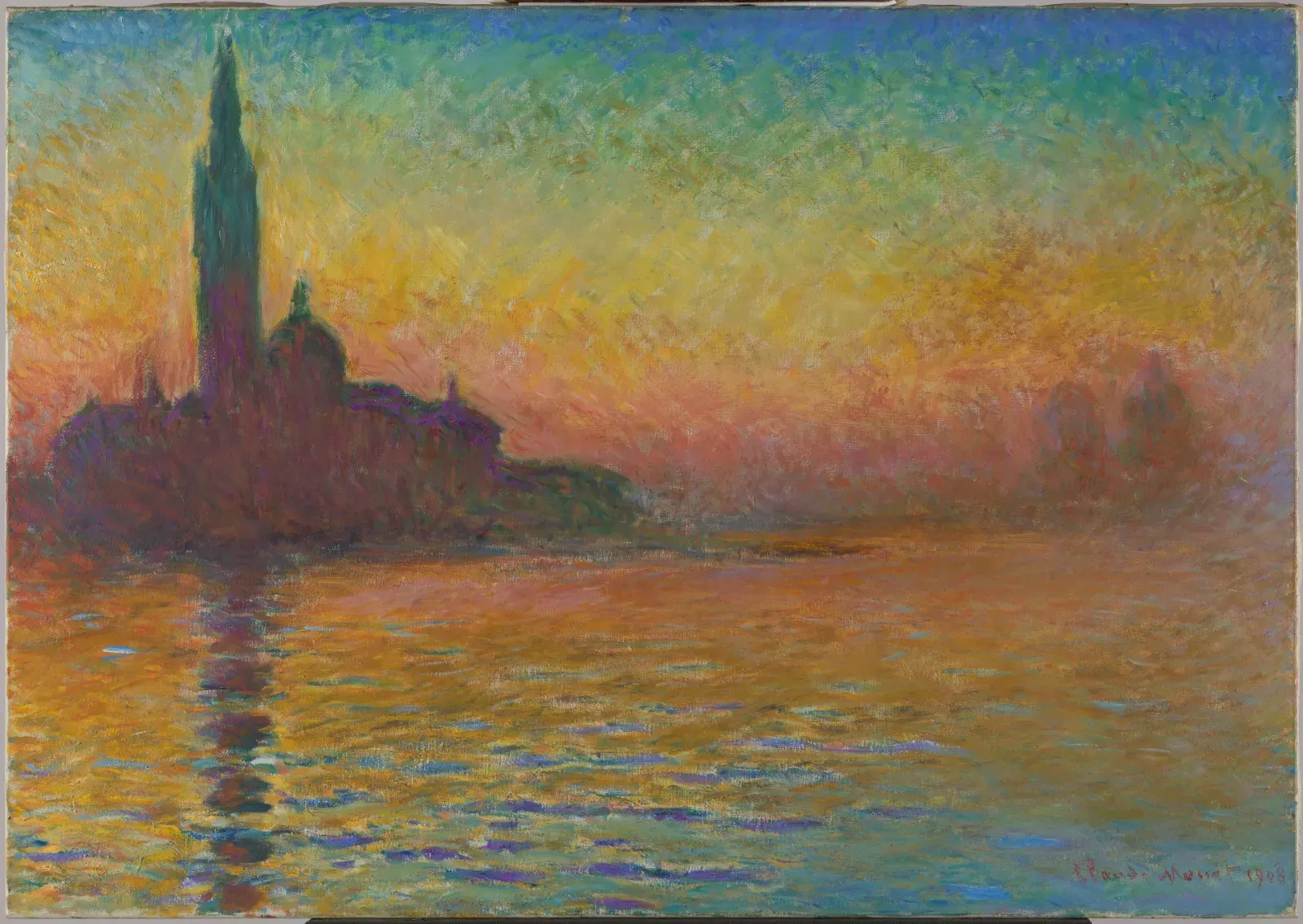 Silhouette of a church with a bell tower and dome on the water, under a sky shading from green to orange