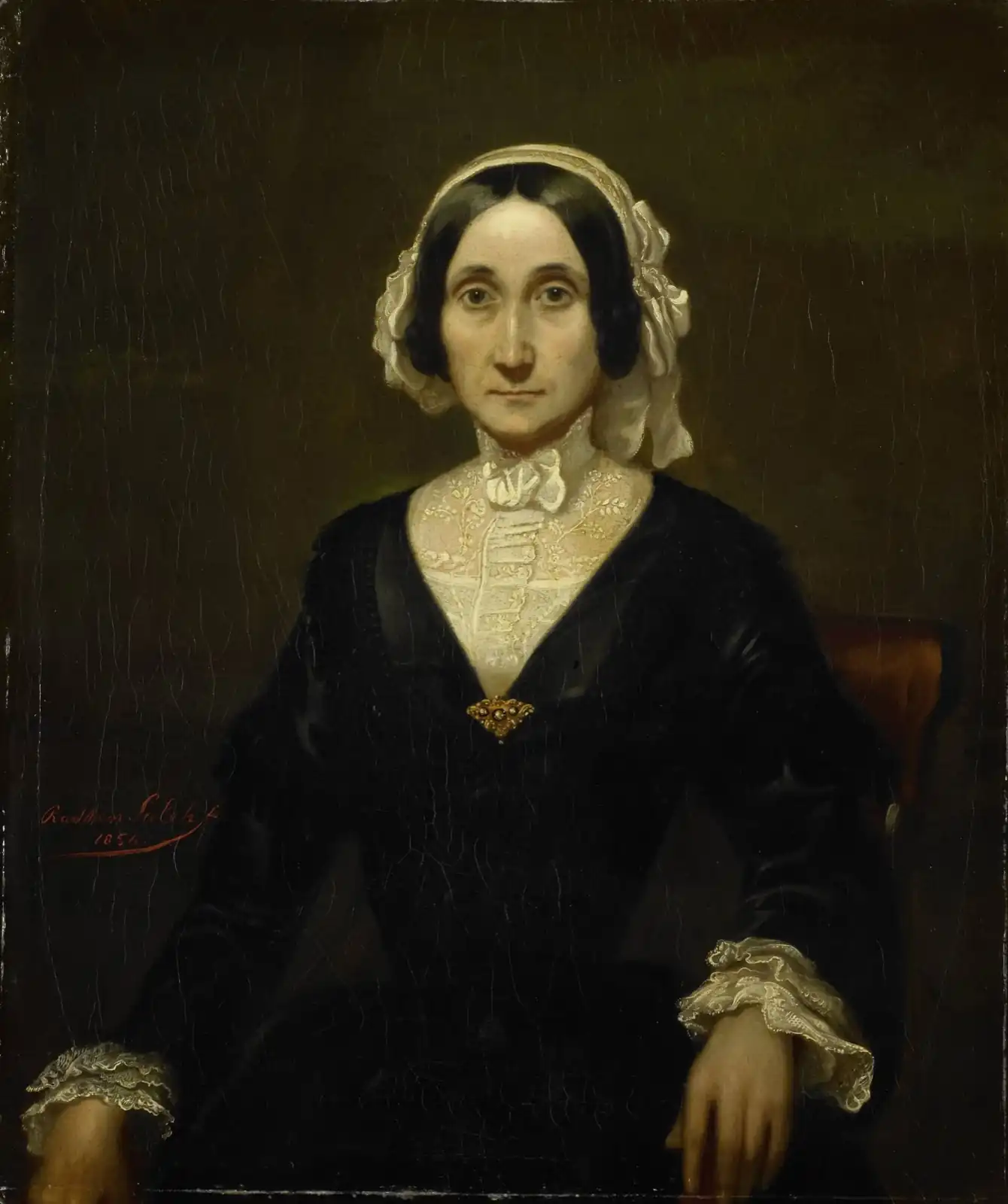 Seated woman in a black dress, white lace cap and collar and a gold brooch, against a dark background