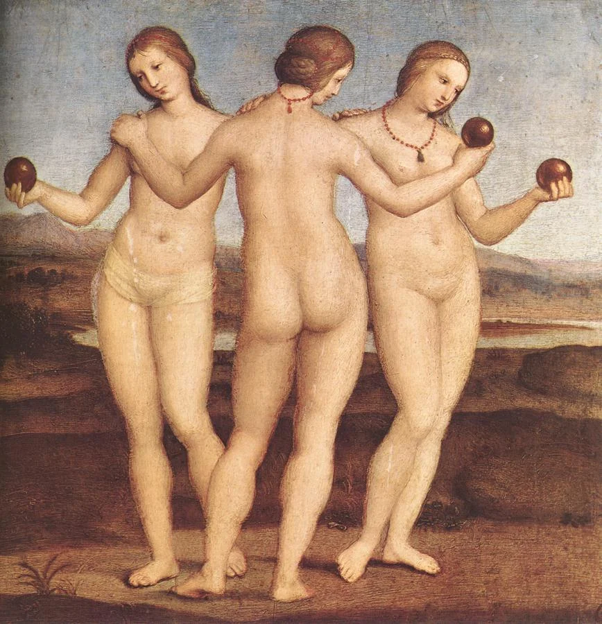 Three nude women, arms around each other’s shoulders, hold small red spheres in a landscape of hills and water