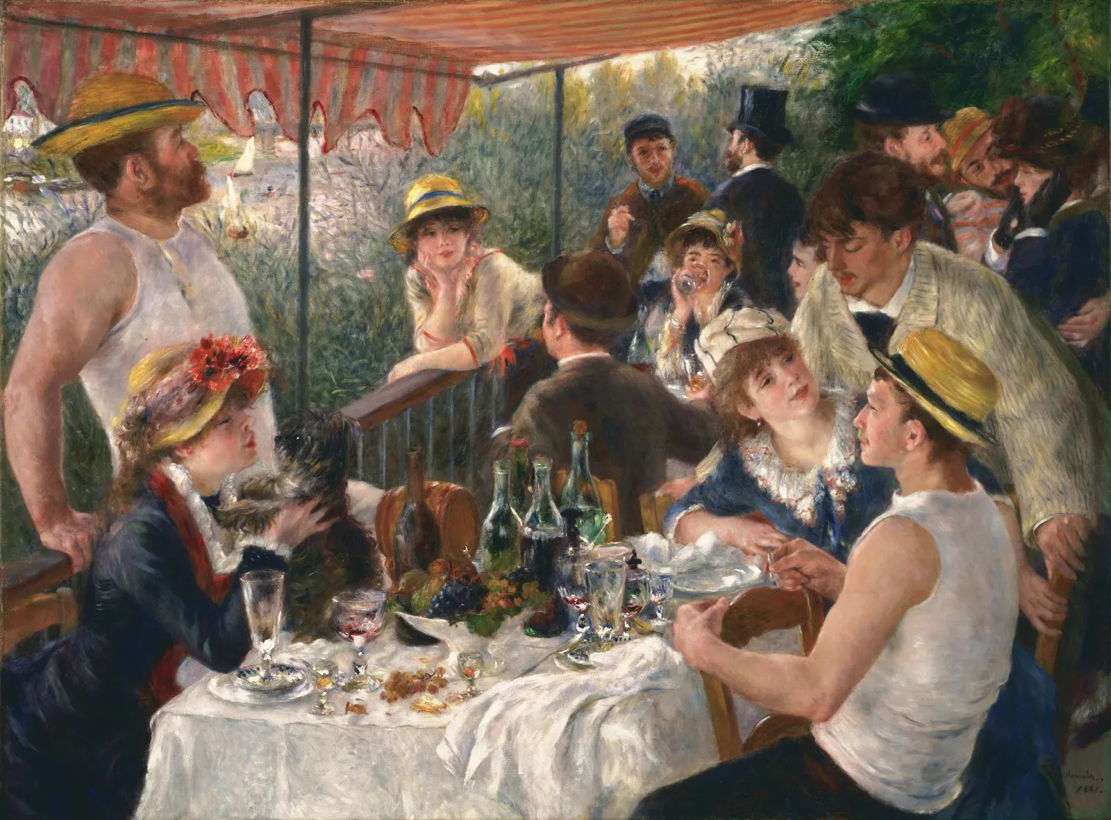 Friends gathered around a table with fruit and wine on a balcony under a red-and-white striped awning by a river