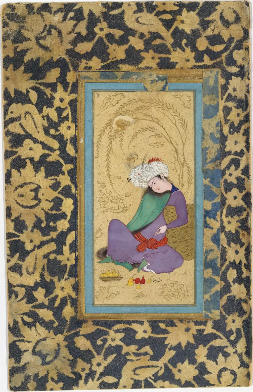 Seated youth in a white turban, purple robe and fur-lined green coat, leaning on a golden cushion