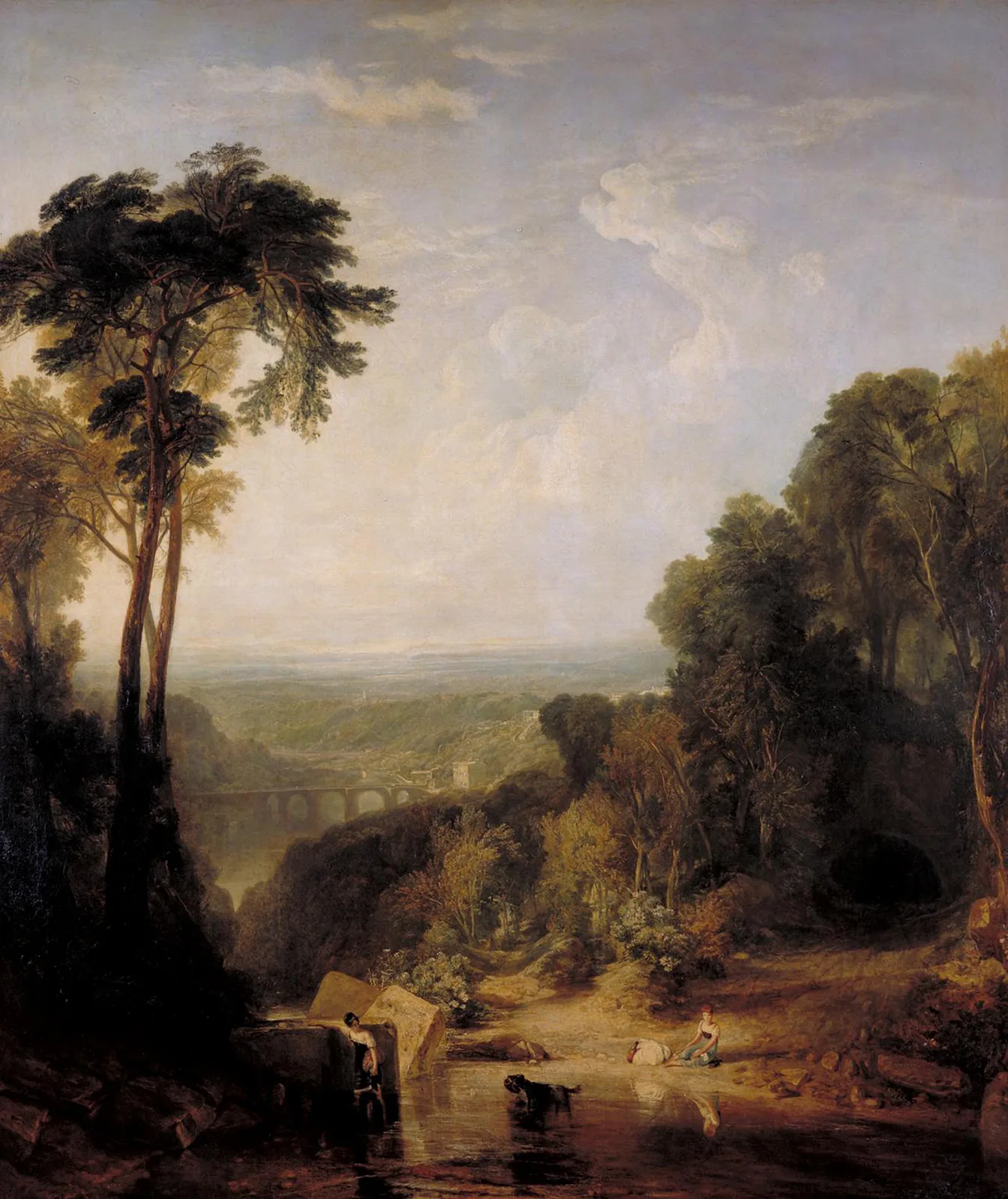 Wide valley with a distant arched bridge, framed by tall trees, with two girls and a dog at a shallow stream